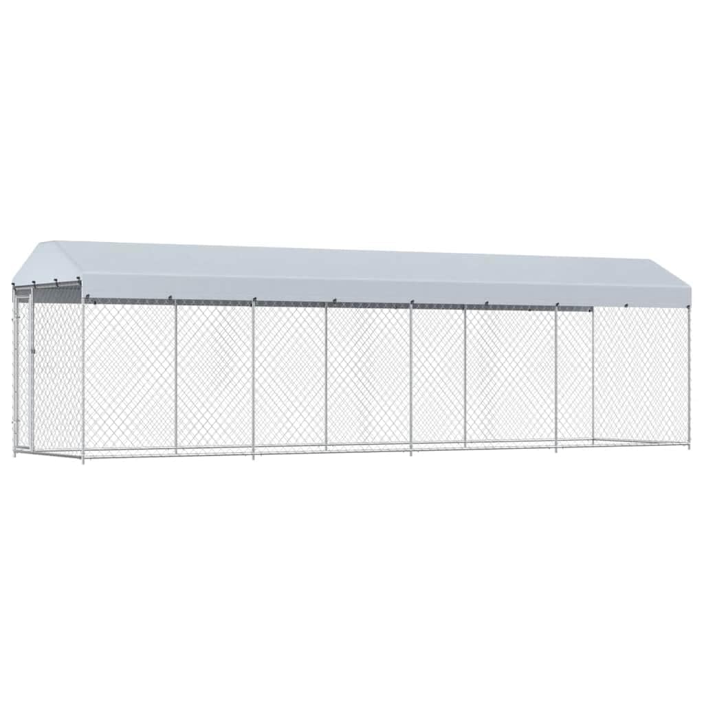 Fully assembled vidaXL outdoor dog kennel with roof, situated in a grassy backyard.