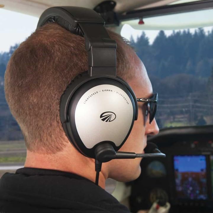Pilot wearing Lightspeed Sierra headset in a cockpit