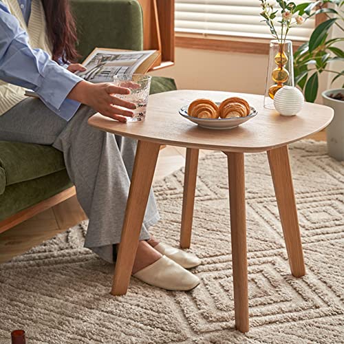 Petite table basse ronde en bois massif avec pieds robustes