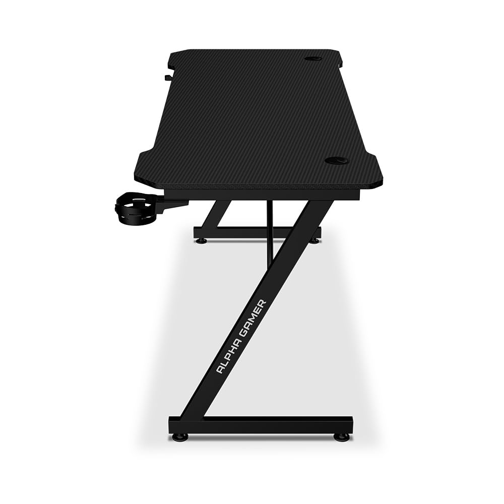 Alpha Gamer Gemina Black 140x60 cm – Escritorio Gamer con Soporte Auriculares, Portavasos, Gestión de Cables, Tapa Textura Carbono, Patas Ajustables – Negro