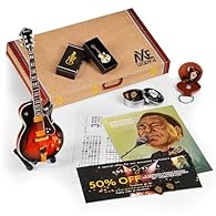 What's in the Box? We're so glad you asked! Apart from the FREE guitar course, here’s what’s packed inside the George Benson Axe Legend Box: Axe Legends miniature wooden George Benson GB10 guitar made from mahogany, complete with mini A-frame stand. ...