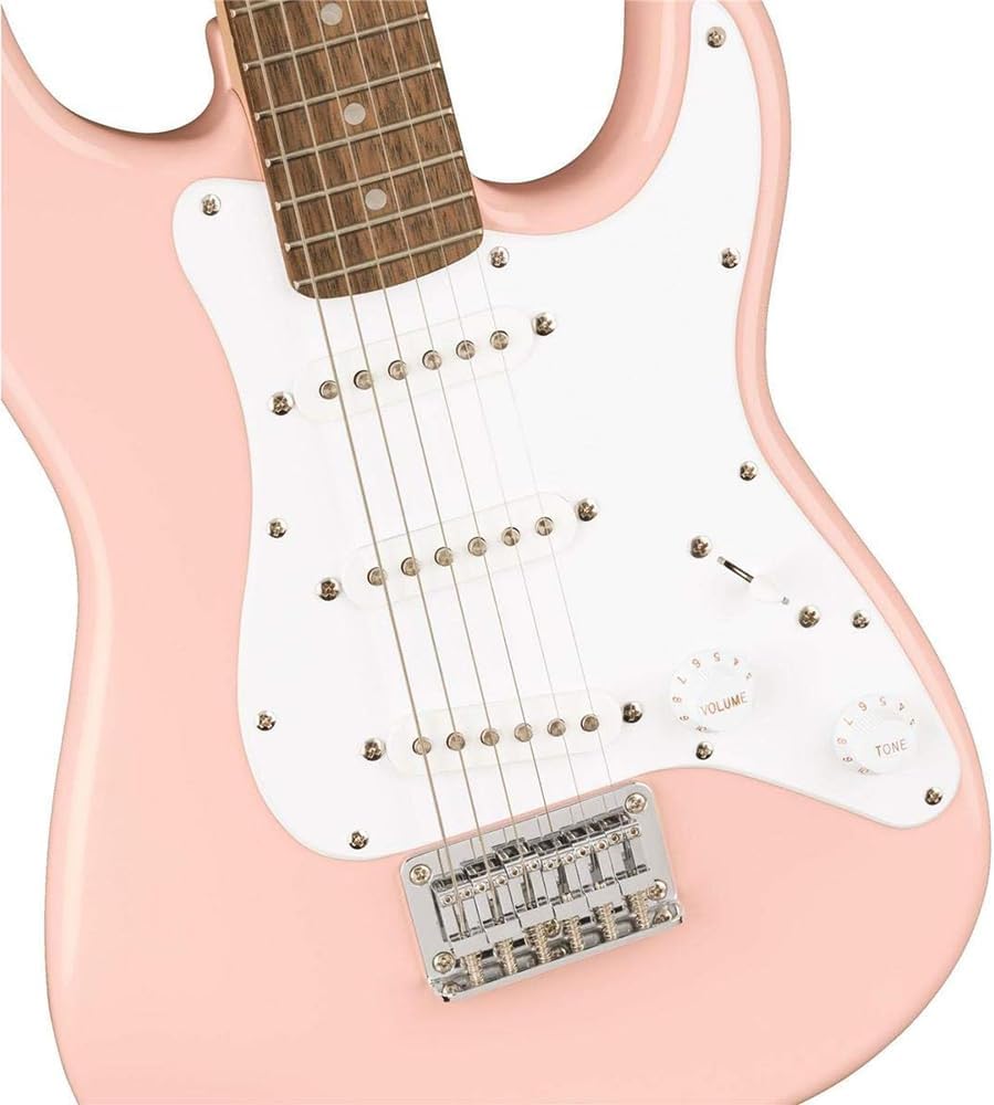Squier Mini Stratocaster Electric Guitar- Shell Pink Bundle with Fender Professional Instrument Cable (10ft), Logo Guitar Strap and Classic Celluloid Guitar Picks 12-Pack