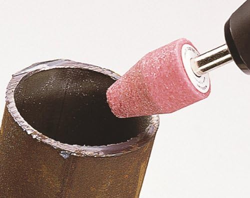 Image showing a conical mounted grinding stone attached to a rotary tool, being used to deburr the inside edge of a metal pipe.