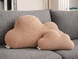 Le coussin décoratif fait bonne figure dans le lit d'enfant ou sur le canapé