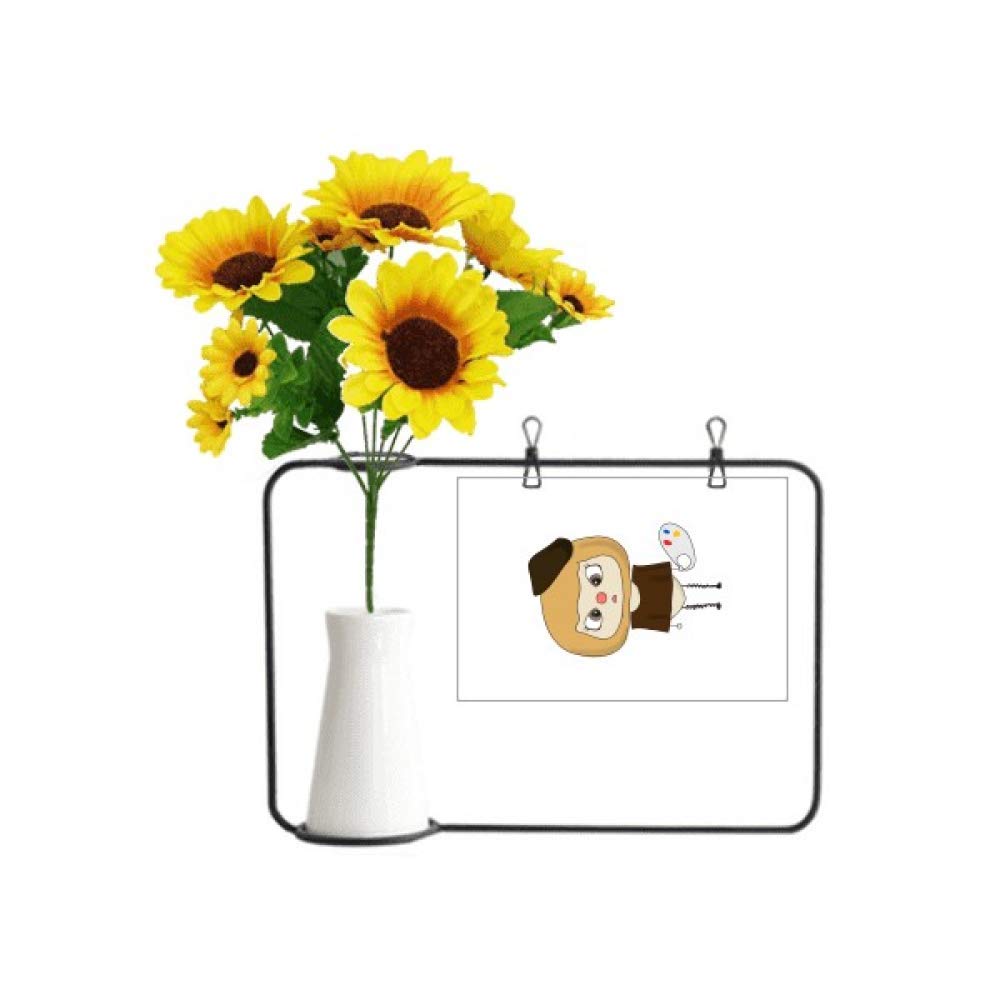 Tournesol artificiel en bouteille et papier à lettres pour décorer un bureau d'artiste