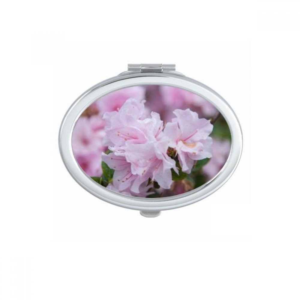 Miroir de poche compact et ovale avec un beau motif de fleurs rouge foncé pour retouches