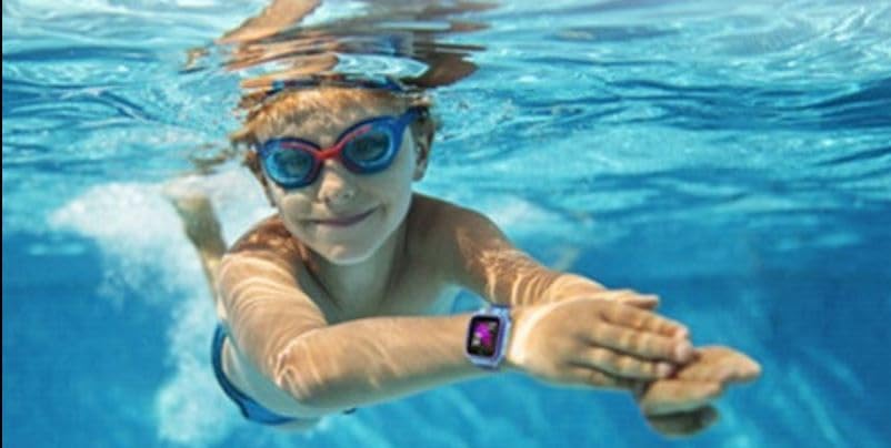 Child swimming underwater wearing the Kurio Smart Watch