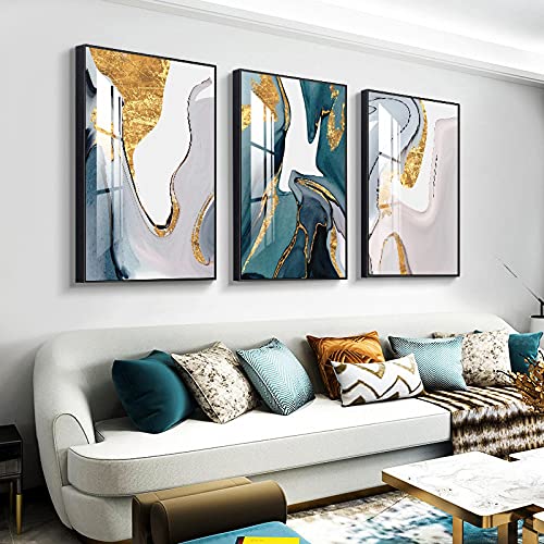 Peintures pour salon : habillez un mur vide avec ce triptyque abstrait bleu et or