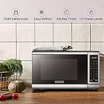BLACK+DECKER EM720CB7 Four à micro-ondes numérique avec porte à bouton-poussoir, serrure de sécurité pour enfants, 700W, Acier inoxydable, 0.7 Cu.ft