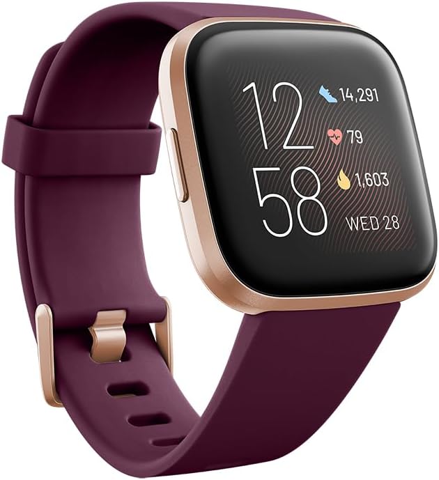 Reloj inteligente Versa 2 de salud y fitness con frecuencia cardíaca, música, Alexa integrada, seguimiento del sueño y la natación, burdeos/rosa cobre, talla única (bandas S y L incluidas)