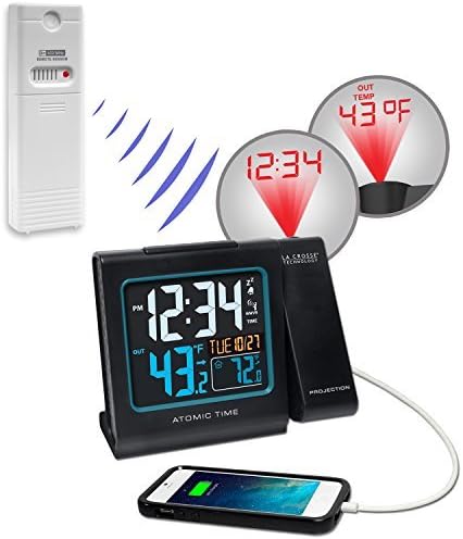 La Crosse Technology Alarm Clock with wireless outdoor sensor and a smartphone charging via USB port.