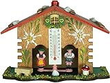 Aus handbemaltem Holz gefertigt, hat es ein Thermometer mit Temperaturmessung in C und F hingegen mit der Bewegung der beiden Figuren auch die Feuchtigkeit in der Luft.