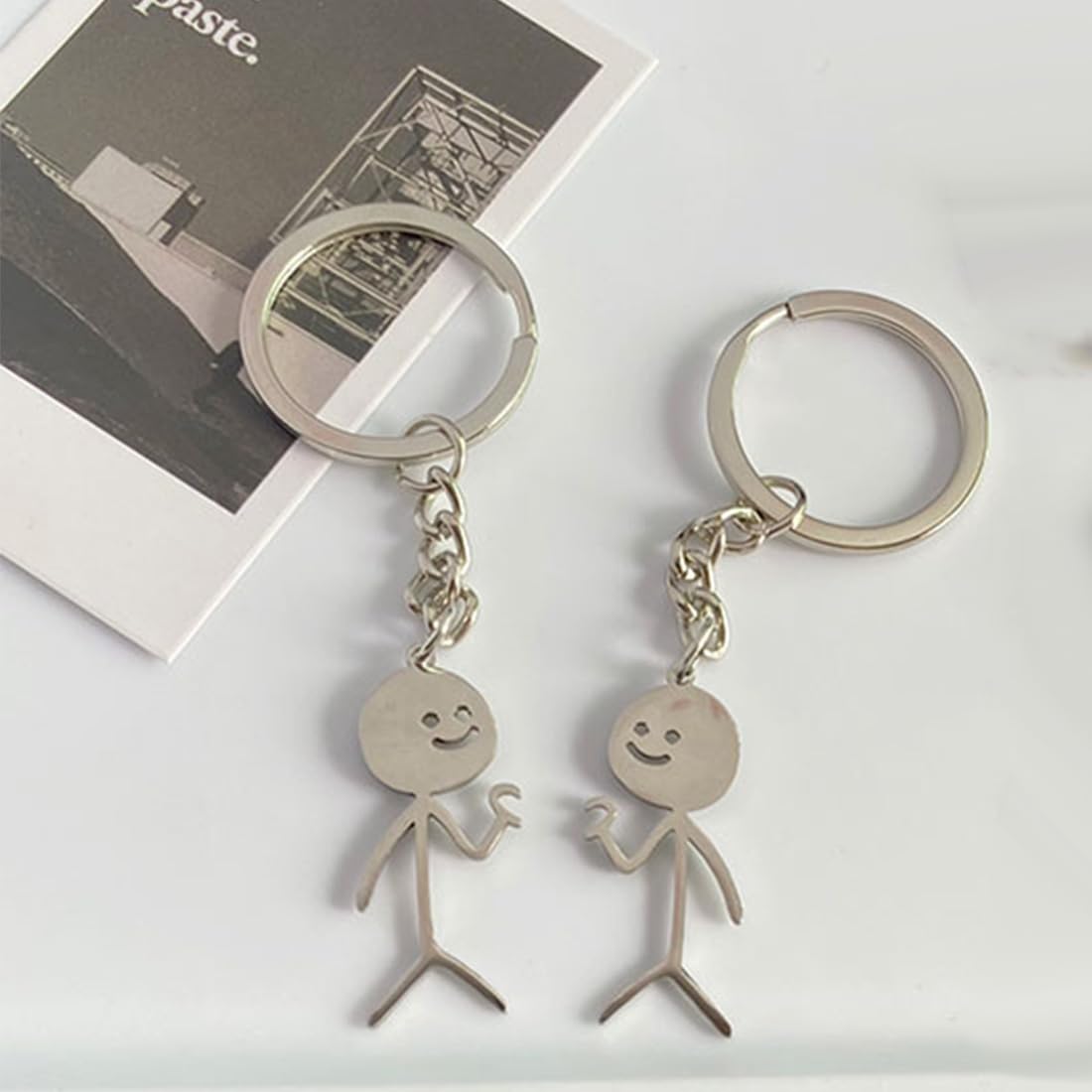 Confezione da 2 portachiavi con faccina divertente con