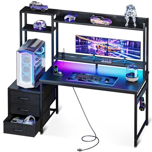 Gaming desk setup featuring a carbon fiber design, dual monitors, RGB lighting, gaming accessories, and storage drawers, ideal for enhancing gaming experience and ergonomic comfort.