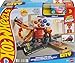 Hot Wheels Toy Car Track Set, Gumball Machine Playset with 1:64 Scale Die-Cast Donut-Shaped Vehicle & Speed Snap Track, Downtown City Candy Shop
