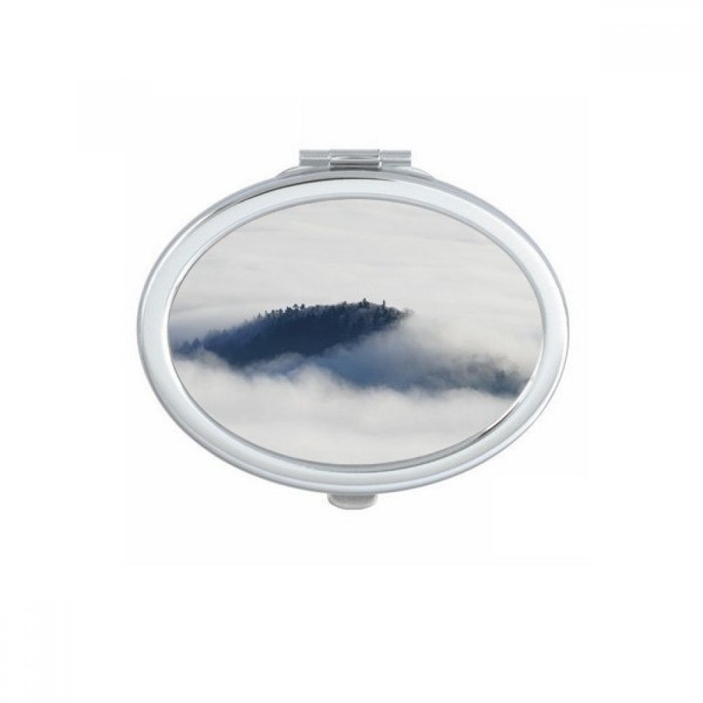Miroir à la main pour retouches rapides avec illustration forêt et montagne