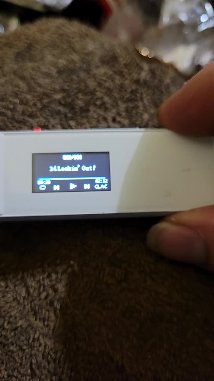 MP3 player screen displaying music playback information, including track number, song title, and playback controls