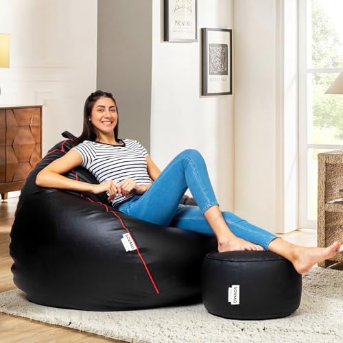Image of Amazon Brand - Solimo 5XL Faux Leather Bean Bag with Footstool & Cushion Combo for Living Room | Bean Bag Filled with Beans | Capacity Upto 6'7 inch Height & 130 Kg Weight | (Black with Pink Piping)