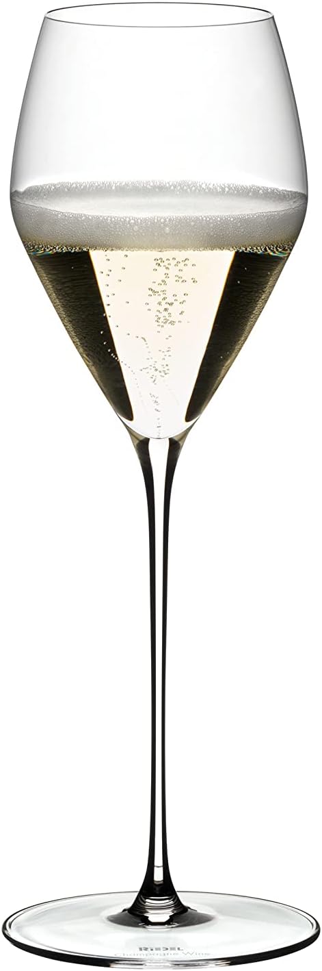 A single Riedel Veloce Champagne glass filled with sparkling wine.