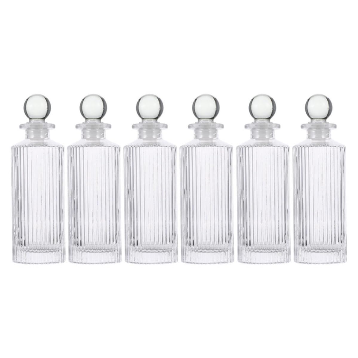Botellas difusoras de vidrio para crear ambientes relajantes con aceites esenciales en casa