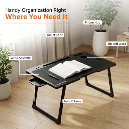 Image of Amazon Basics Engineered Wood Foldable Laptop Table with Cup and Pen Holder, Tablet and Mobile Phone Groove | Mini Drawer, Use for Writing, Bed, Breakfast (60L x 40W x 25H cm, Black)