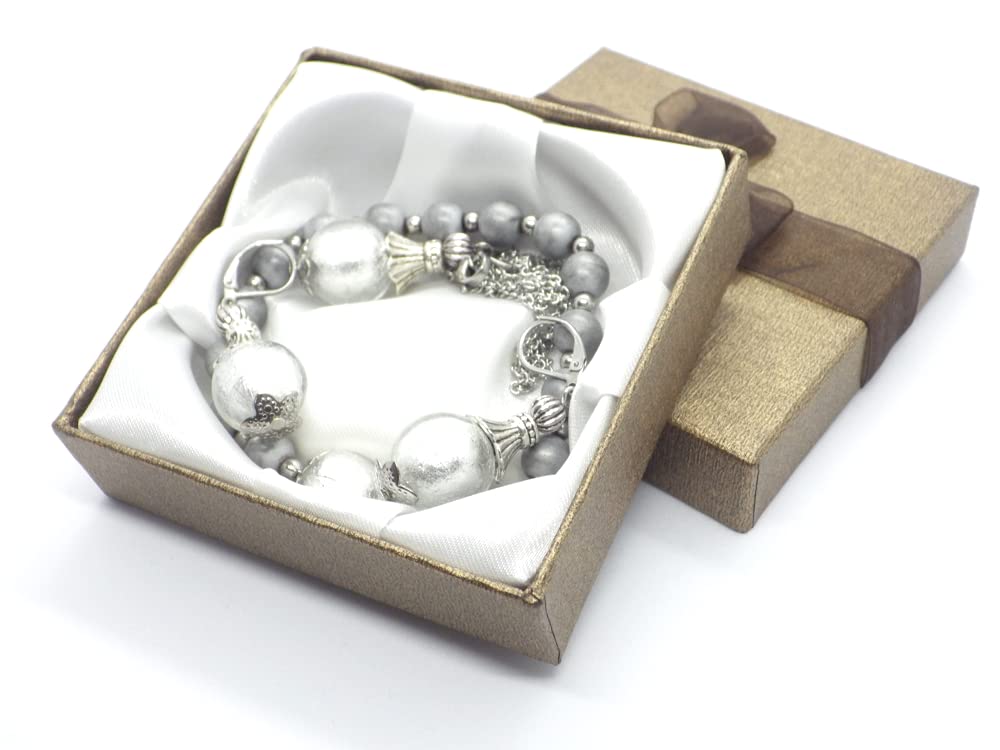 Conjunto de joyería pendientes, collar y pulsera en acero inoxidable, hematites y cuentas de cristal de Murano blanco