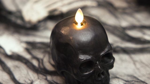 Image of Luminara Flameless Halloween Decor - Skeleton Figural LED Candle Natural Color, Ivory, 3.74 inch x 4.25 inch Real Wax Moving Flame Battery Operated w /Timer