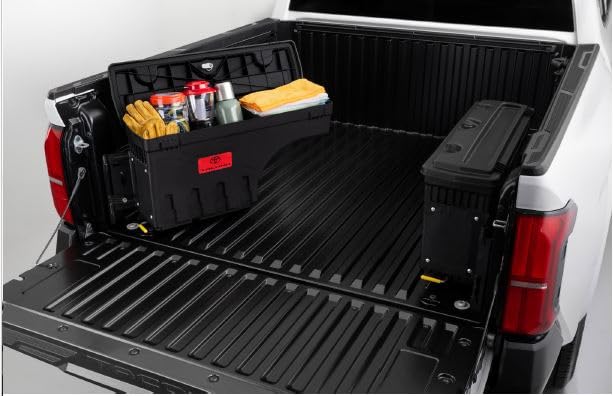 Toyota Tacoma Swing Out Storage Box installed in a truck bed, showing it swung out with items inside.