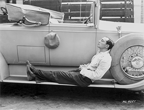 Buster Keaton Sleeping on a car Photo Print (10 x