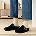CUSHIONAIRE Haven Genuine Leather Clogs for Women – Faux Fur Lined Slip-On Womens Shoes with Cork Footbed and Adjustable Buckle, Black 9