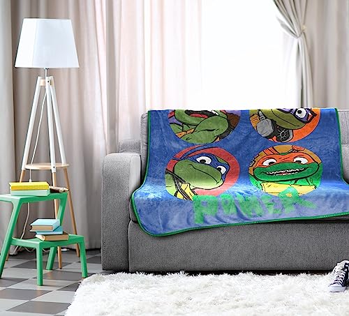 Image of Jay Franco Plush Throw Blanket - 46 inch x 60 inch Inches Kids Hero Soft & Cozy Fleece Throw for Bedroom & Couch Decor, Official Licensed Product, Blue - Teenage Mutant Ninja Turtles