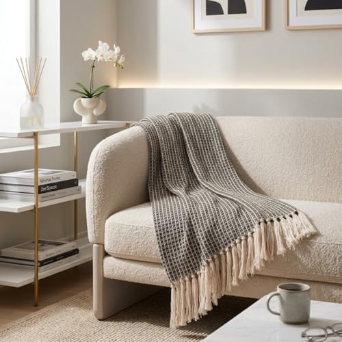 Image of SAJAVAT HOME Hand-Knitted Cotton Sofa Throw | All-Season Throw Blanket for Sofa, Bed, Couch, Chair & Travel | 68x50 Inches (177x127cm) | Black with Tassels | Pack of 1