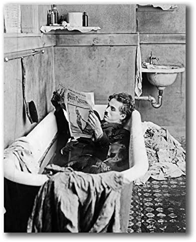 Globe Photos ArtPrints A Film Still of Charlie Chaplin Reading A Newspaper in A Bathtub - 8" X 10" Pop Culture Art Photographic Full Bleed Print - Premium Paper