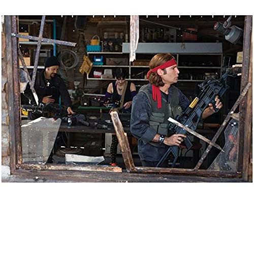 Corey Feldman holding weapons (The Lost Boys Movie) - 8 inch x10 inch PHOTOGRAPH Performer & Actor Color PHOTOGRAPH-CJ