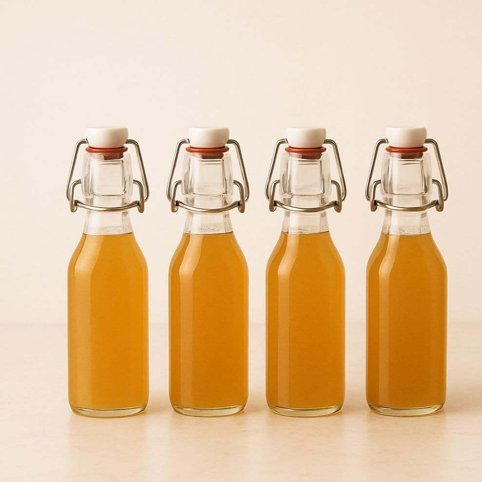 Image of Clear Glass Bottles with Airtight Swing Top Lids - Leakproof Reusable Round Glass Jars for Water, Juice, Kombucha, Milk, Vinegar, Oil & Beverages - Pack of 4 (Clear)