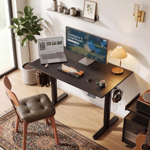 Image of Claiks Electric Standing Desk, 40x24 Inches, Black | Black frame and deep black top, ideal for home office, height adjustable for sitting and standing