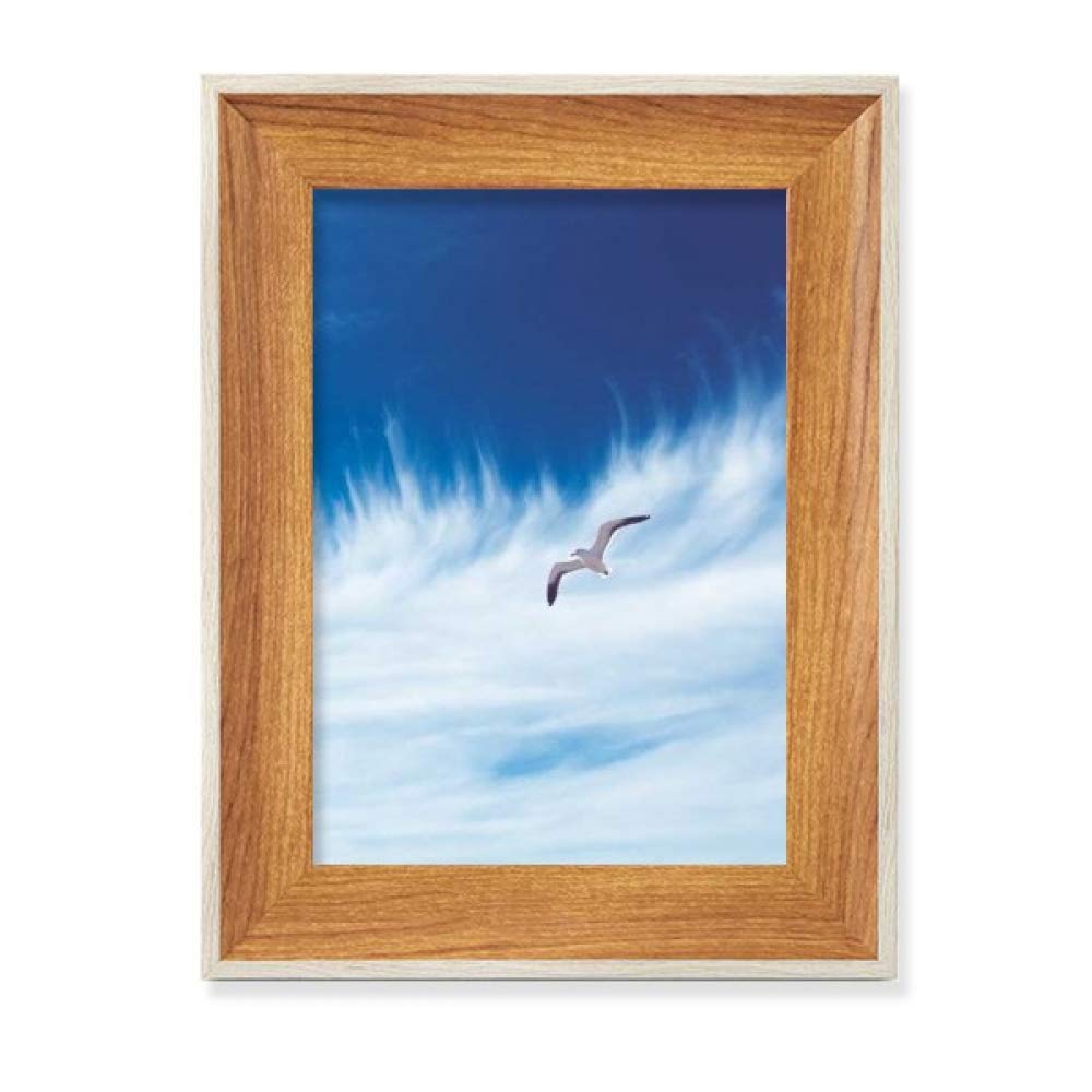 Cadre de photo en bois l'oiseau bleu du ciel de nuages pour décoration