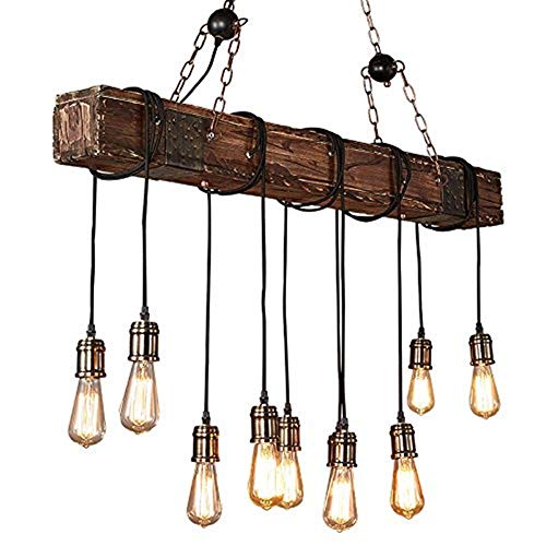 Lustre vintage style de ferme pour illuminer une grande table sombre avec une suspension rustique