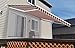 ALEKO Automatic Retractable Patio Awning| 20' W x 10' L Motorized Crank Deck Canopy| White Frame, Polyester Water Resistant| UV Protection Sun Shade| Multi-Stripe Red