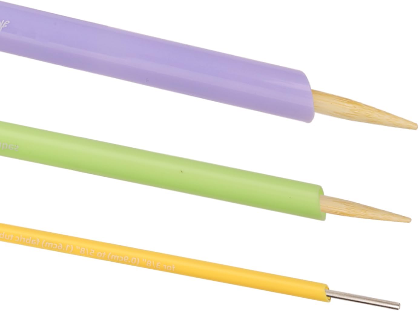 Close-up image of the three fabric tube turners, showing their different sizes and the pointed wooden sticks.
