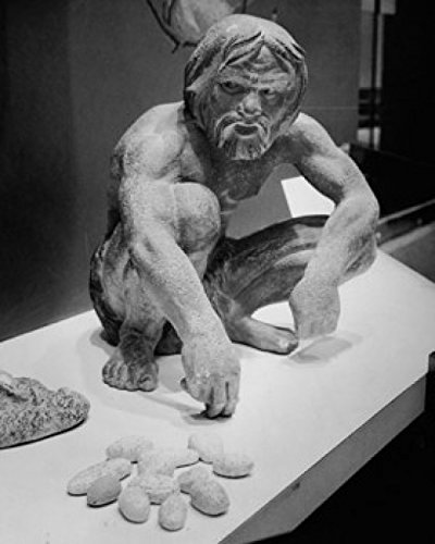 Amazon.com: Posterazzi Statue of a Caveman Using Stones to