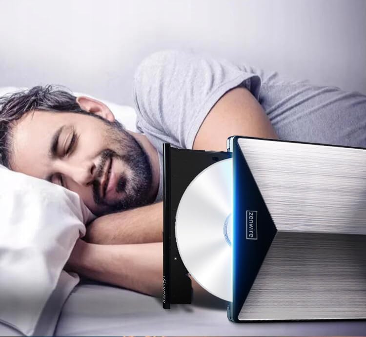 A hand peeling off a protective film from the surface of the Zenwire External CD/DVD Drive.