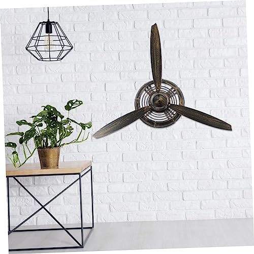 Décoration murale avion hélice Cabilock en métal pour style industriel unique