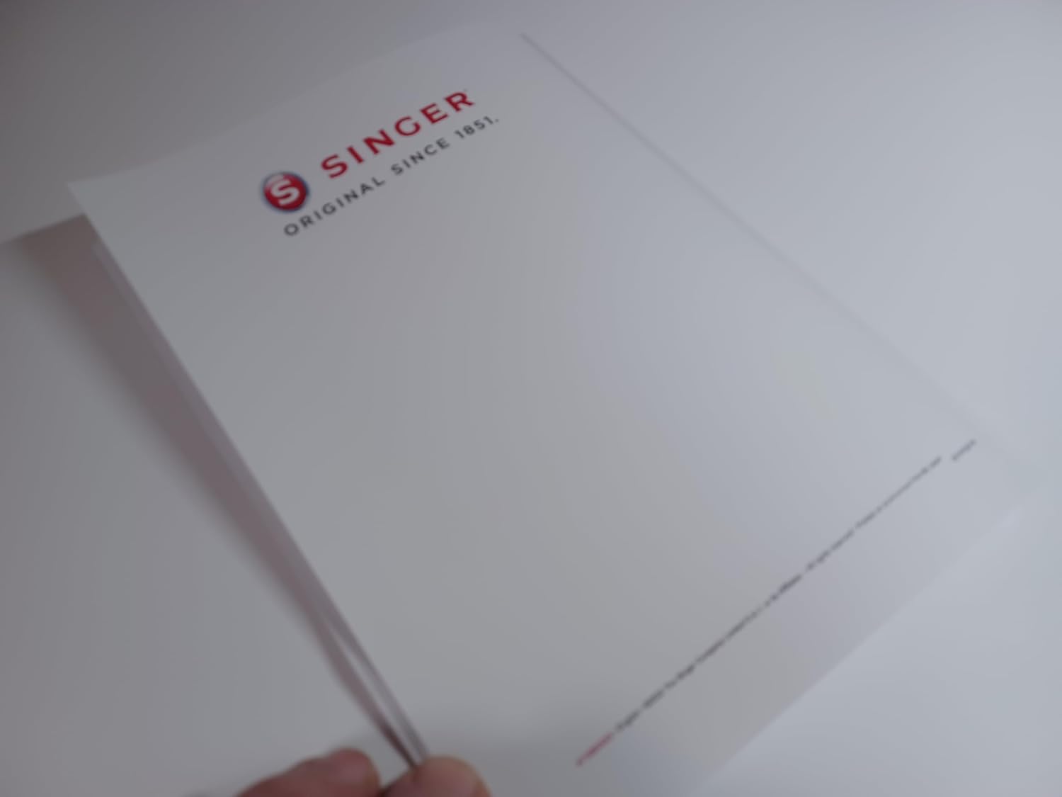 Back cover of the Singer C5900 Instruction Manual with Singer logo