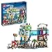 Produktbild LEGO 60380 City Stadtzentrum Set, Modellbausatz, Spielzeug mit Spielzeugläden wie Friseur, Tierarzt, Hotel und Dachdisco mit Minifiguren und Straßenplatten, Geschenk zum Geburtstag für Kinder