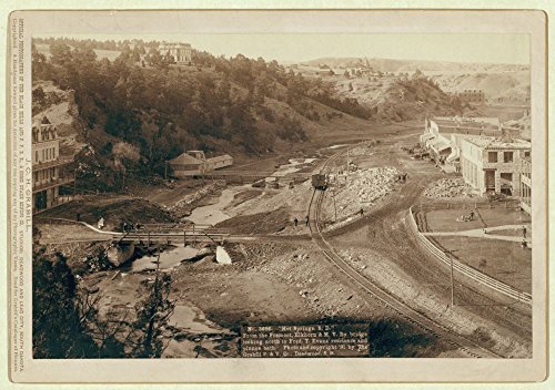1891 Photo "Hot Springs, S.D." From the Fremont, Elkhorn and M.V. Ry. bridge looking north to Fred T. Evans residence and plunge bath Bird's-eye view of a developing small town with railroad track run