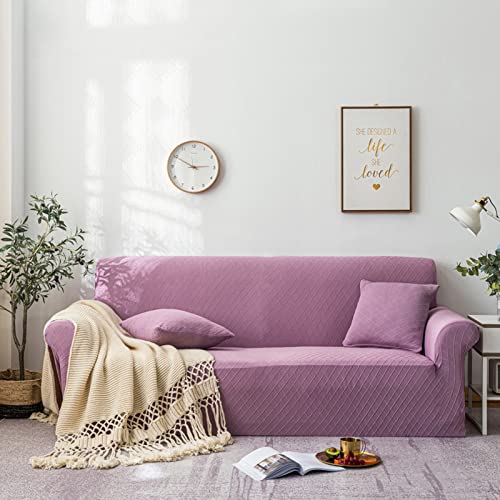 Housse de canapé extensible rose pour protéger le fauteuil du salon