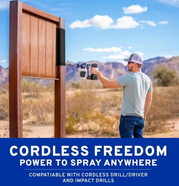 Man spraying a fence outdoors