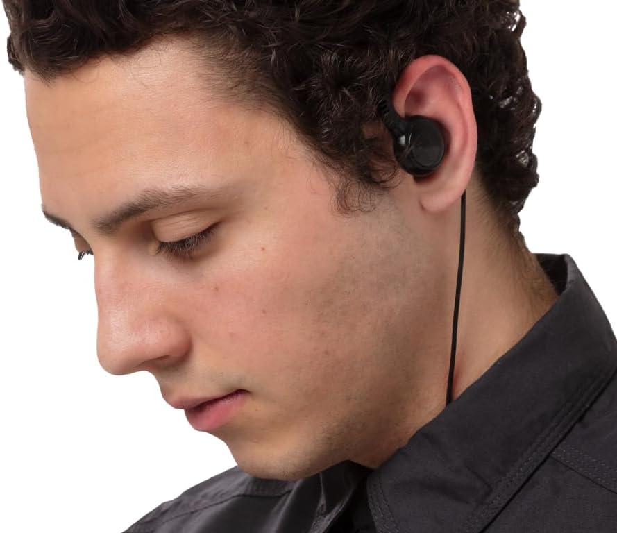 Close-up of a user's ear with the EarHugger swivel earpiece properly fitted.