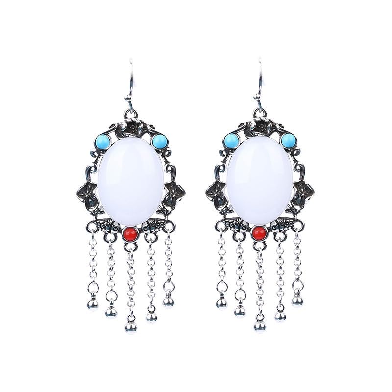 Boucles d'oreilles pierre blanche et gland argenté parfaits pour illuminer vos soirées d'été